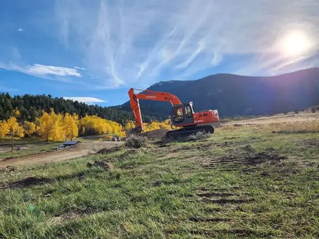 Hitachi excavator performing foundation excavation in Montana